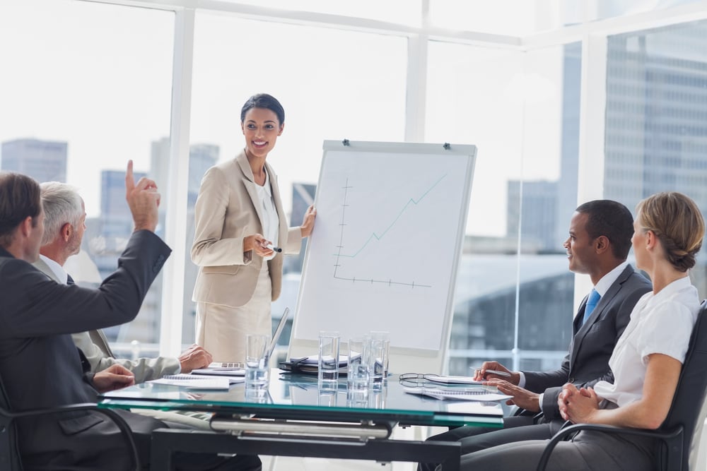 Colleagues asking a question to a businesswoman during a presentation-1