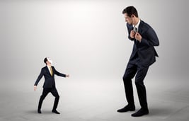 Conflict between small masked businessman and big elegant businessman